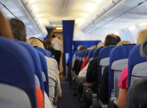 5 Yoga Poses To Help You Stretch Out In an Airplane Seat